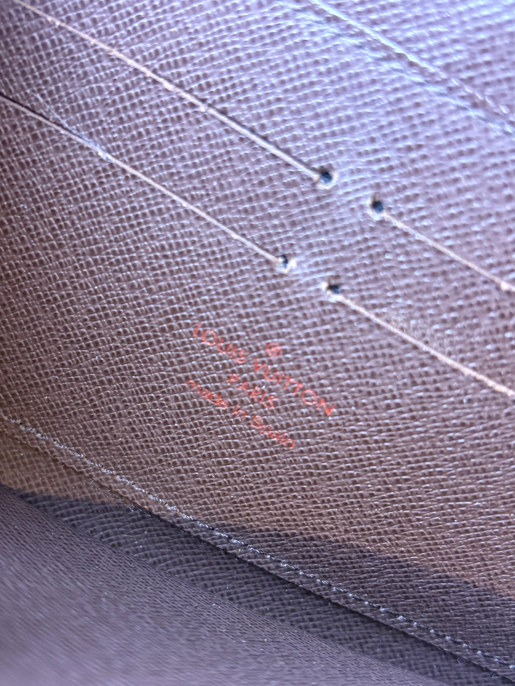 Louis Vuitton Damier Ebene Zippy Wallet logo