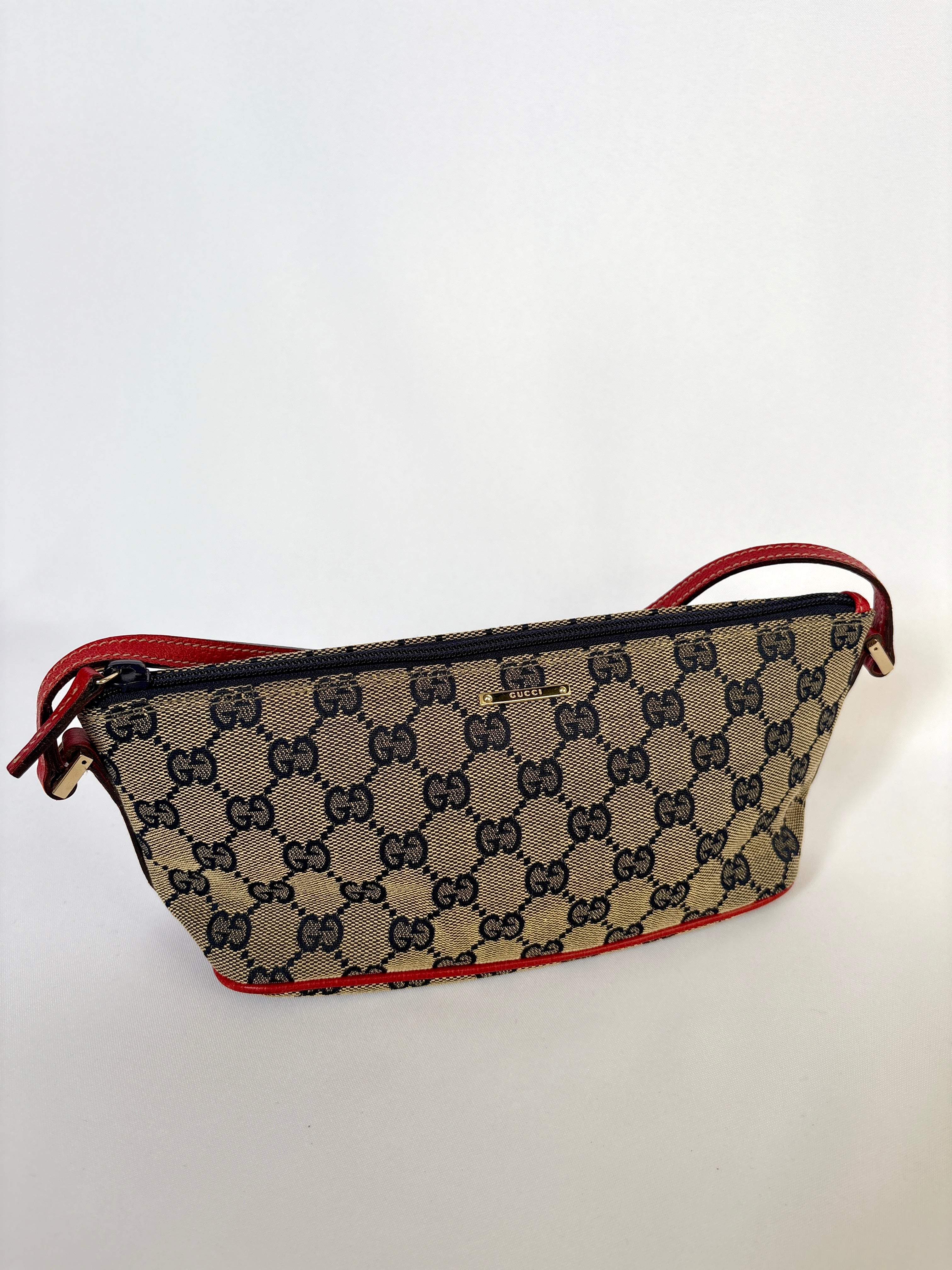 Gucci Pochette Boat Bag navy blauw rood GG canvas vintage designer