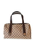 Gucci GG Monogram Charmy Boston tas in beige canvas met bruine leren details en gouden hardware