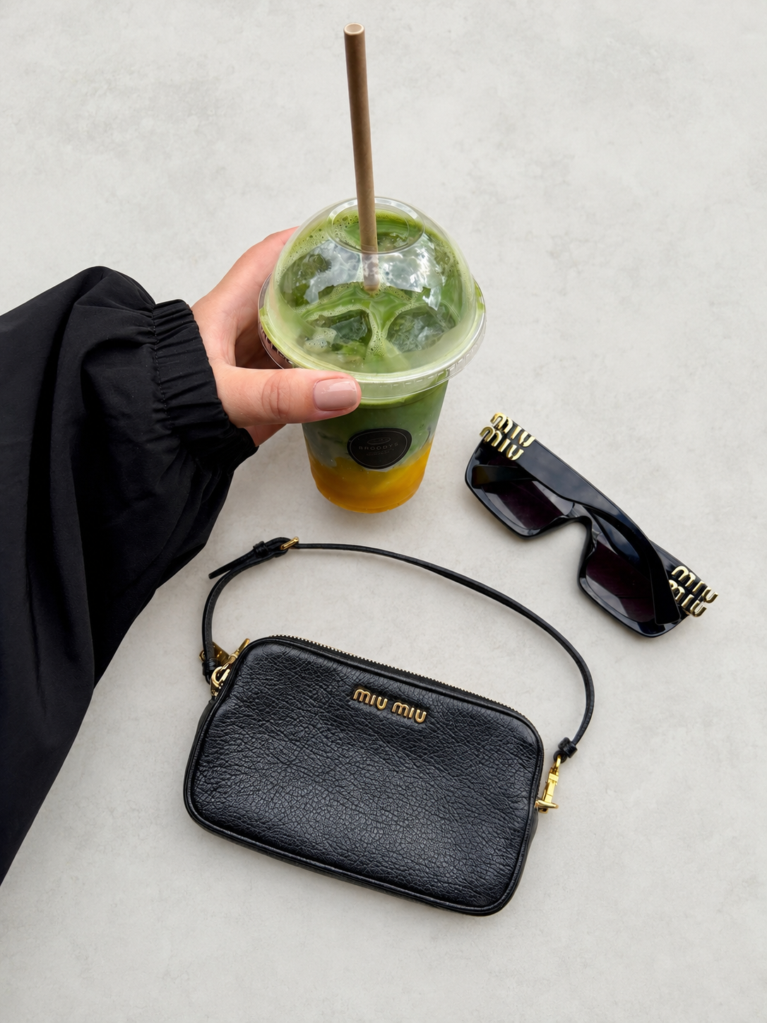 Pre-loved Miu Madras Goatskin Double Zip Pochette aesthetic flatlay