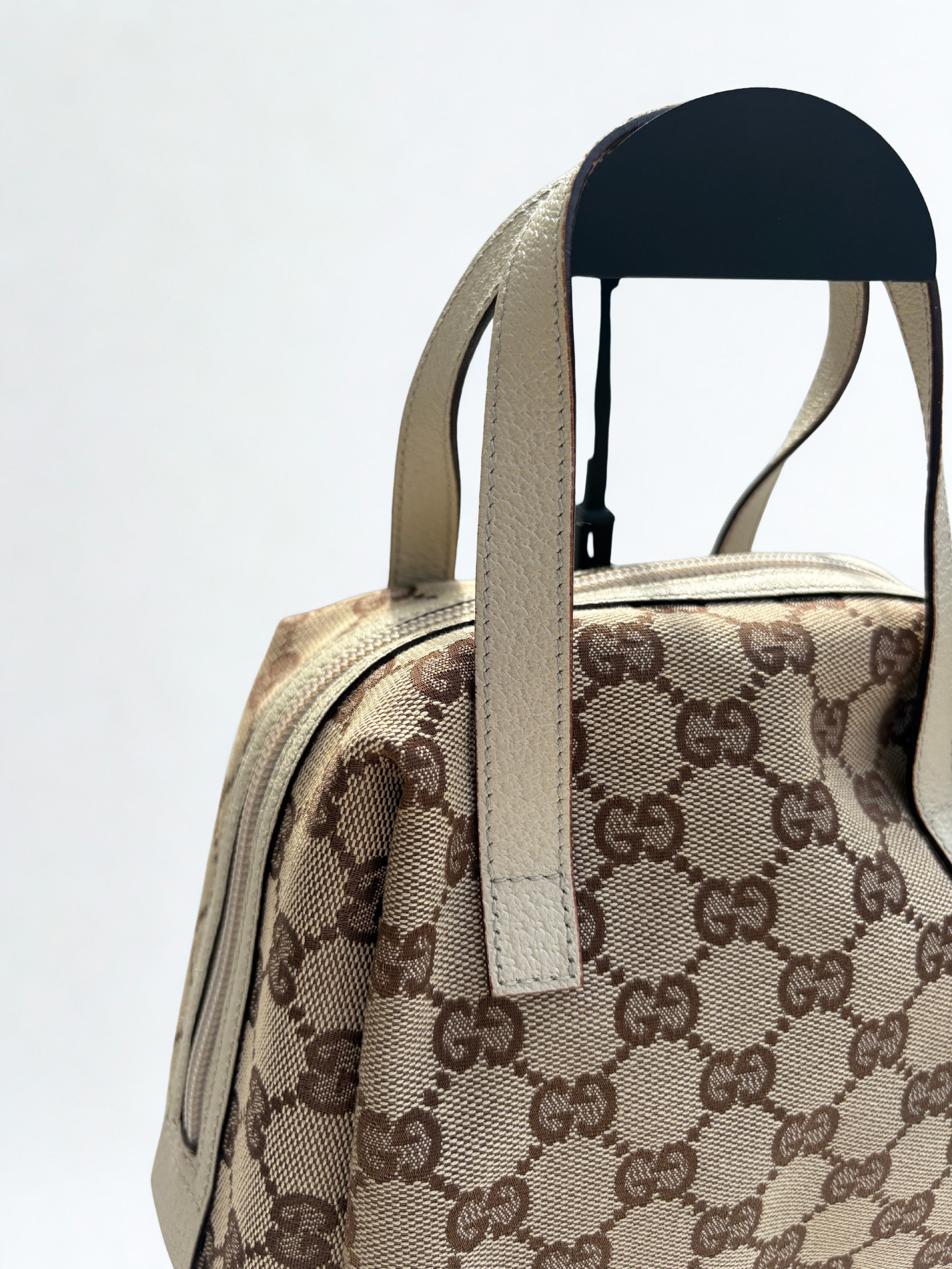 Gucci Monogram Canvas close up beige handles